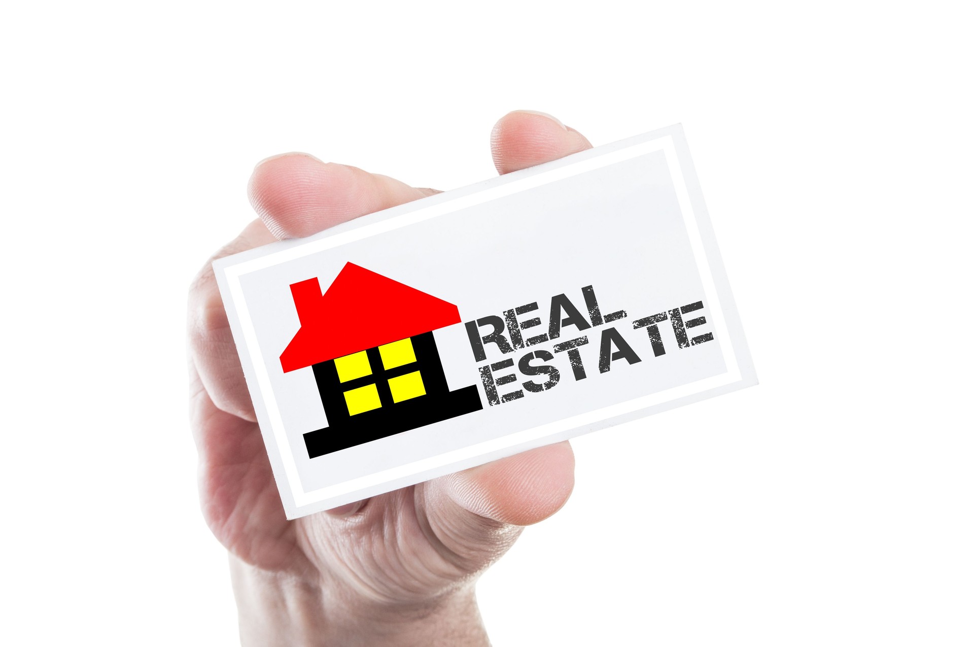 Hand holding real estate card with house shape and text